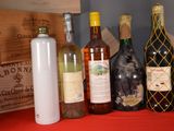 many bottles of wine and bottles of wine on a table