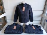 three pieces of clothing on display in a store