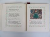 an open book with a picture of a woman in a green dress