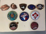 a close up of a white board with a bunch of badges on it