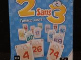 a card game in a tin box with numbers on it