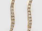 a pair of gold and diamond ear climbers