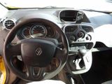 dashboard of a small car with a steering wheel and dashboard controls