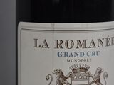 a close up of a bottle of wine on a table