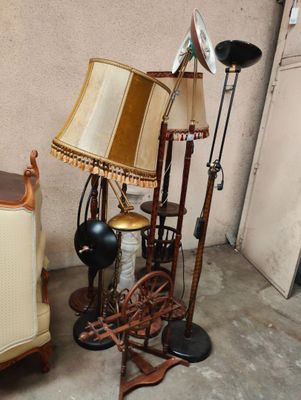 a chair and a lamp on the floor in a room