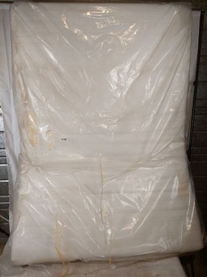 a picture of a mattress that is wrapped up and ready to be shipped