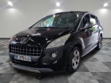 a picture of a small black car parked in a garage