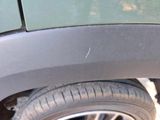 a close up of a car ' s front bumper with a hole in it