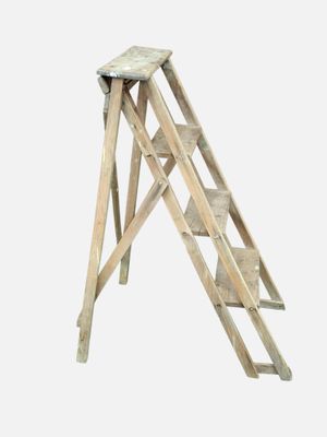 a small wooden step stool with a ladder on top of it