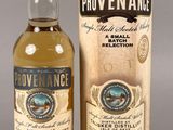 a bottle of provenance and a cardboard box