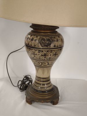 a lamp that is sitting on a table with a lamp on it