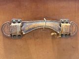 a close up of a leather belt on a wooden surface