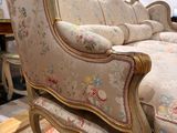 a couch that is sitting on a rug in a room