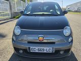 a small car that is parked on the side of the road