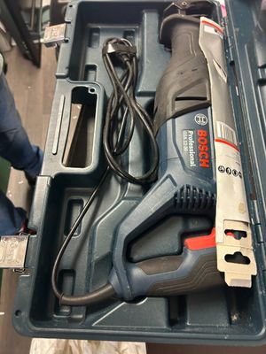 an image of a corded drill in a tool box