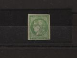 the stamp is green and has a picture of a woman on it
