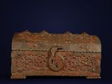 an old metal box with a lock on a blue background