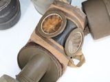 a gas mask and a camera sitting on a table
