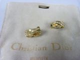 pair of christian dior cuff earrings with diamonds and emeralds