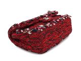 a close up of a red and black purse on a white background