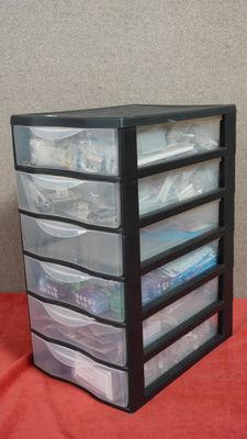 an image of a stack of plastic drawers on a table