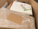 a cardboard box with a lot of items inside of it