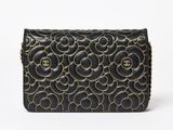 a black and gold purse with a chain strap