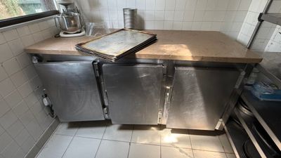 a kitchen with a stove, dishwasher, and refrigerator in it