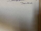someone is writing on a white board in a room