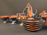 a lot of plates and cups on the table