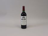 a bottle of wine that is sitting on a table