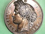 an image of a coin with a woman ' s head on it
