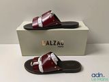 a close up of a pair of sandals on a box