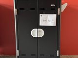 a black locker with a lot of paper on it