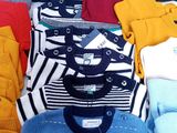 a pile of sweaters and sweaters sitting on a table
