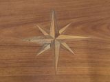 a wooden table with a star design on it