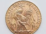l'image d'une pièce d'or ornée d'un coq