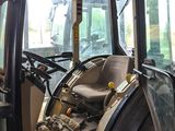a tractor that is sitting in the back of a truck