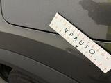 a sticker on the back of a car that has a ruler attached to it