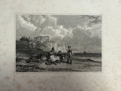 une vieille photo montrant un groupe de personnes sur la plage