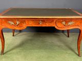 an antique desk with a marble top and two drawers