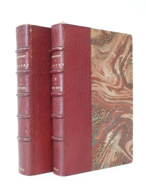 the two books are sitting side by side on a white surface