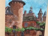 une photo d'un tableau représentant un château, dans un cadre