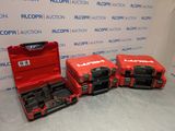 three red tool boxes are lined up in a row on the floor