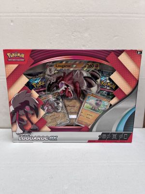 La boîte est ouverte pour montrer le contenu du jeu de cartes à collectionner Pokémon.