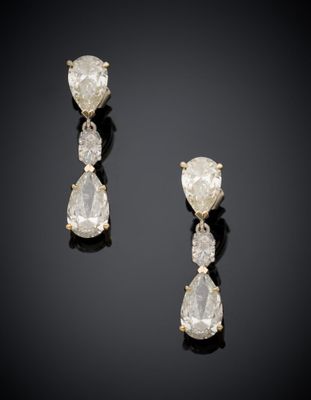 a pair of diamond and gold earrings
