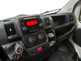 a dashboard view of a car with a red light on