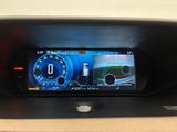 the dashboard of a car with a digital display showing the speed of a car