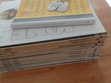 books stacked on top of each other on a wooden table