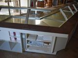 a counter with a glass display case on top of it